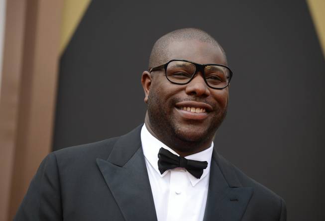 Director Steve McQueen arrives at the Oscars on Sunday, March 2, 2014, at the Dolby Theatre in Los Angeles.  (Photo by Jordan Strauss/Invision/AP)